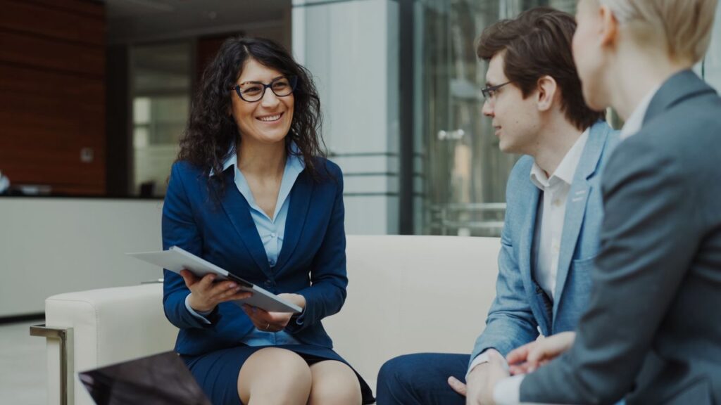 Mastering the First Impression: Your intriguing post title goes here Professionals discussing business strategy in a corporate office setting.